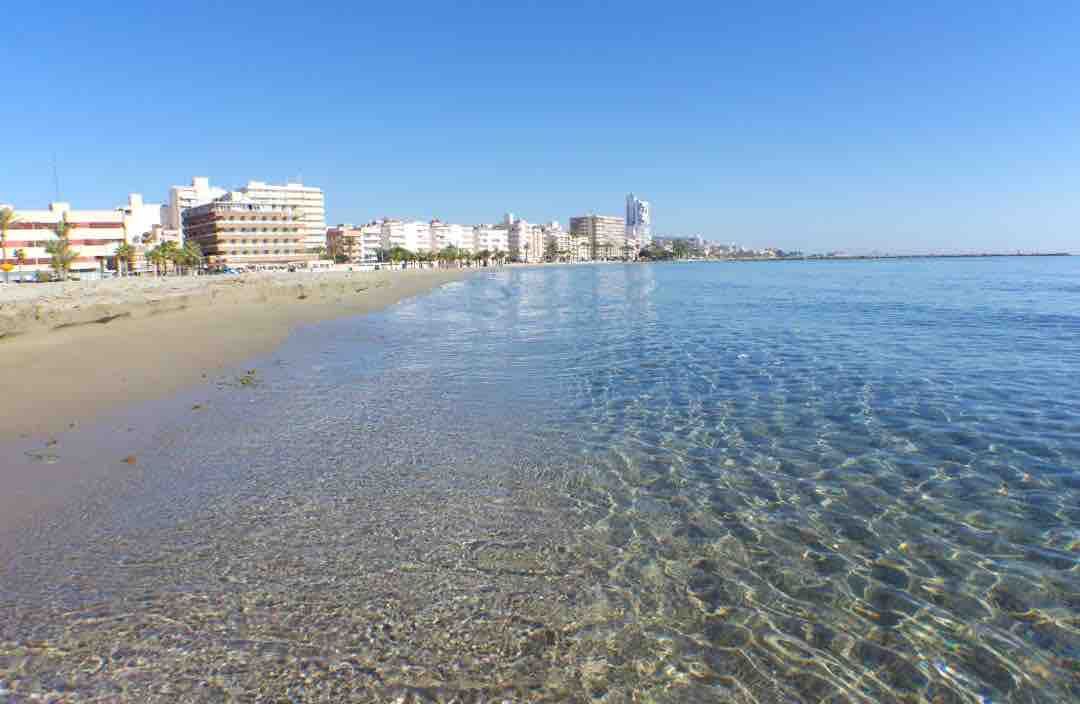 Clear, shallow water on the beach of Santa Pola